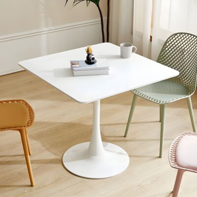 A sleek, modern square dining table with a single pedestal base in a minimalist design.