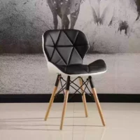 Stylish Eames Chair with a molded ergonomic seat, wooden dowel legs, and a sleek, mid-century modern design, perfect for any interior.