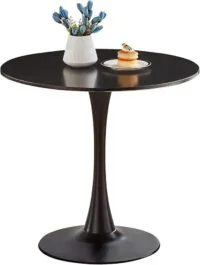 "Modern round dining table with a smooth wood surface and minimalist metal legs in a contemporary dining room."