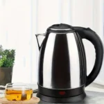 A sleek 1.8L stainless steel cordless kettle on a kitchen countertop, designed for fast and efficient boiling.