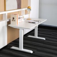 Modern electric powered home office desk with adjustable height and sleek design.