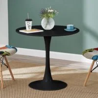 "Modern round dining table with a smooth wood surface and minimalist metal legs in a contemporary dining room."