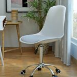 Iconic Eames Swivel Chair with sleek curved backrest and 360-degree swivel base, offering comfort and modern style.