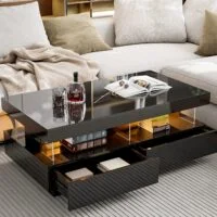 Modern living room coffee table with sleek design, glass top, and metal legs, placed in a stylish living room setting.