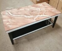 A stylish Marble Top Coffee Table with a sleek, polished surface and a sturdy base, perfect for adding elegance to any living space.