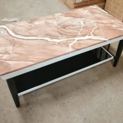A stylish Marble Top Coffee Table with a sleek, polished surface and a sturdy base, perfect for adding elegance to any living space.