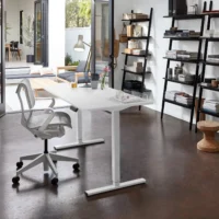 Electric height adjustable home desk with a sleek wooden top and black metal legs, featuring a control panel for height adjustment.
