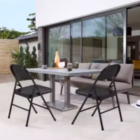 A durable and lightweight foldable metal chair with a sleek design, perfect for indoor and outdoor use.