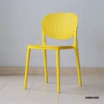Sleek and modern Nordic-style plastic dining chair with a minimalist design.