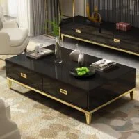 Modern living room coffee table with sleek design, glass top, and metal legs, placed in a stylish living room setting.