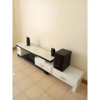 Elegant marble-top TV stand with sleek design and ample storage space.