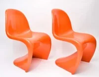 A set of Verner Panton-inspired modern dining chairs featuring smooth, curved plastic seats and a bold, sculptural design perfect for contemporary interiors.