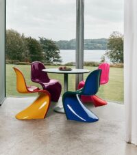 Vitra Panton Mid-Century Dining Table featuring sleek lines and a minimalist design, ideal for modern dining spaces.