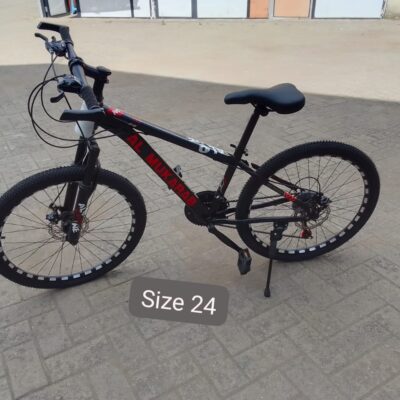 Durable mountain bike designed for off-road trails with knobby tires, suspension, and a sturdy frame.