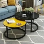 A stylish nesting coffee table set with multiple sizes, offering flexibility in arrangement for modern living rooms.