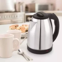 A sleek 1.8L stainless steel cordless kettle on a kitchen countertop, designed for fast and efficient boiling.