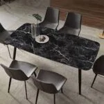 Elegant marble top dining table with a sleek, polished surface and sturdy base, perfect for modern and luxury interiors.