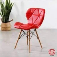 Luxurious Leather Eames Chair with molded wood frame and aluminum swivel base, designed for comfort and timeless style.