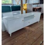 A stylish Bunbury Classic White TV Stand with ample storage, a clean white finish, and cable management for an organized entertainment space.