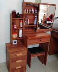 A stylish beauty desk with a mirror, storage drawers, and makeup essentials neatly organized for a perfect self-care routine.