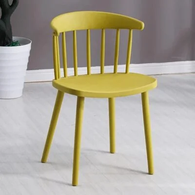 Sleek and stylish Modern Plastic Windsor Dining Chair, featuring a contemporary design with a comfortable seat for dining rooms.