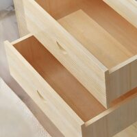 Modern wood-made chest of drawers with a sleek design and spacious compartments for bedroom or living room storage.
