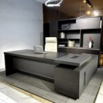 180cm Executive L-shaped Office Desk in modern office, large L-shaped executive desk 180cm, spacious corner office desk with return, wooden executive L-shaped workstation, contemporary 180cm office desk setup, manager L-shaped office desk design, executive corner desk with drawers, 180cm L-shaped desk for corporate office, modern wooden L-shaped office table, executive desk with side storage cabinet, premium 180cm L-shaped workstation, large corner office desk with cable management, executive office furniture L-shaped desk, 180cm manager desk with return table, stylish L-shaped executive desk in workspace, executive office desk with storage drawers, heavy duty 180cm L-shaped desk, corporate L-shaped office desk interior, executive workstation with spacious tabletop, 180cm office desk with sleek finish, professional L-shaped desk for CEO office, wooden corner executive desk 180cm, modern business office L-shaped desk, executive desk with integrated pedestal drawers, spacious 180cm L-shaped desk for productivity, luxury executive corner desk design, contemporary L-shaped office desk furniture, 180cm executive desk with side return, office interior with L-shaped executive desk, executive workstation desk with filing drawers, durable wooden L-shaped office desk, 180cm executive office corner table, premium manager L-shaped desk setup, executive desk with wide legroom space, modern L-shaped desk for home office, 180cm corporate executive desk furniture, corner workstation desk with storage, executive L-shaped desk with smooth finish, large office desk with side extension, 180cm executive desk in professional setting, L-shaped office desk with minimalist design, executive desk with lockable drawers, stylish 180cm office workstation, wooden L-shaped executive desk for boardroom, modern corner desk for executive office, executive L-shaped desk with cable ports, 180cm luxury office desk design, spacious executive corner workstation, professional L-shaped desk with ample storage